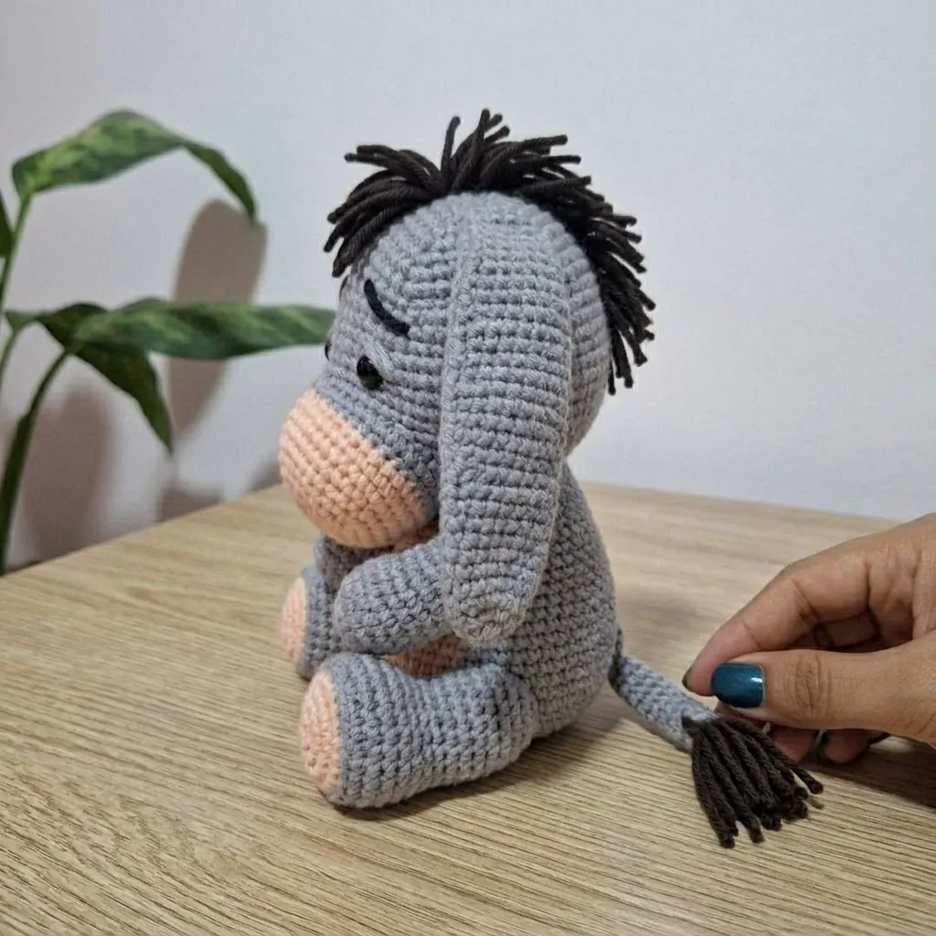 Side view of the donkey amigurumi with tail